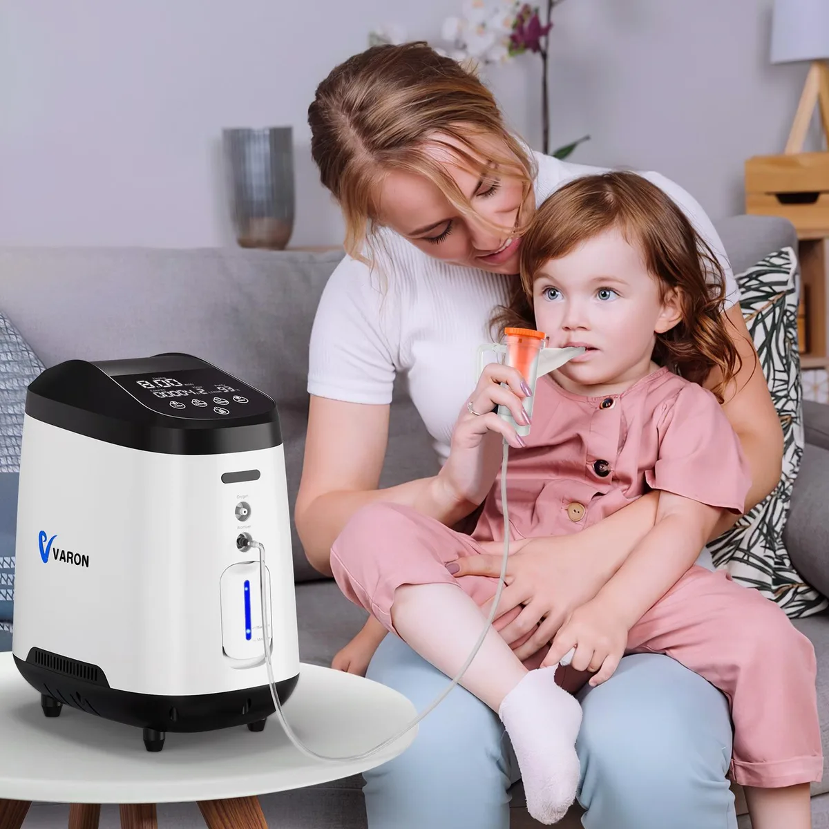 Black rectangular oxygen concentrator with display panel and humidifier bottle