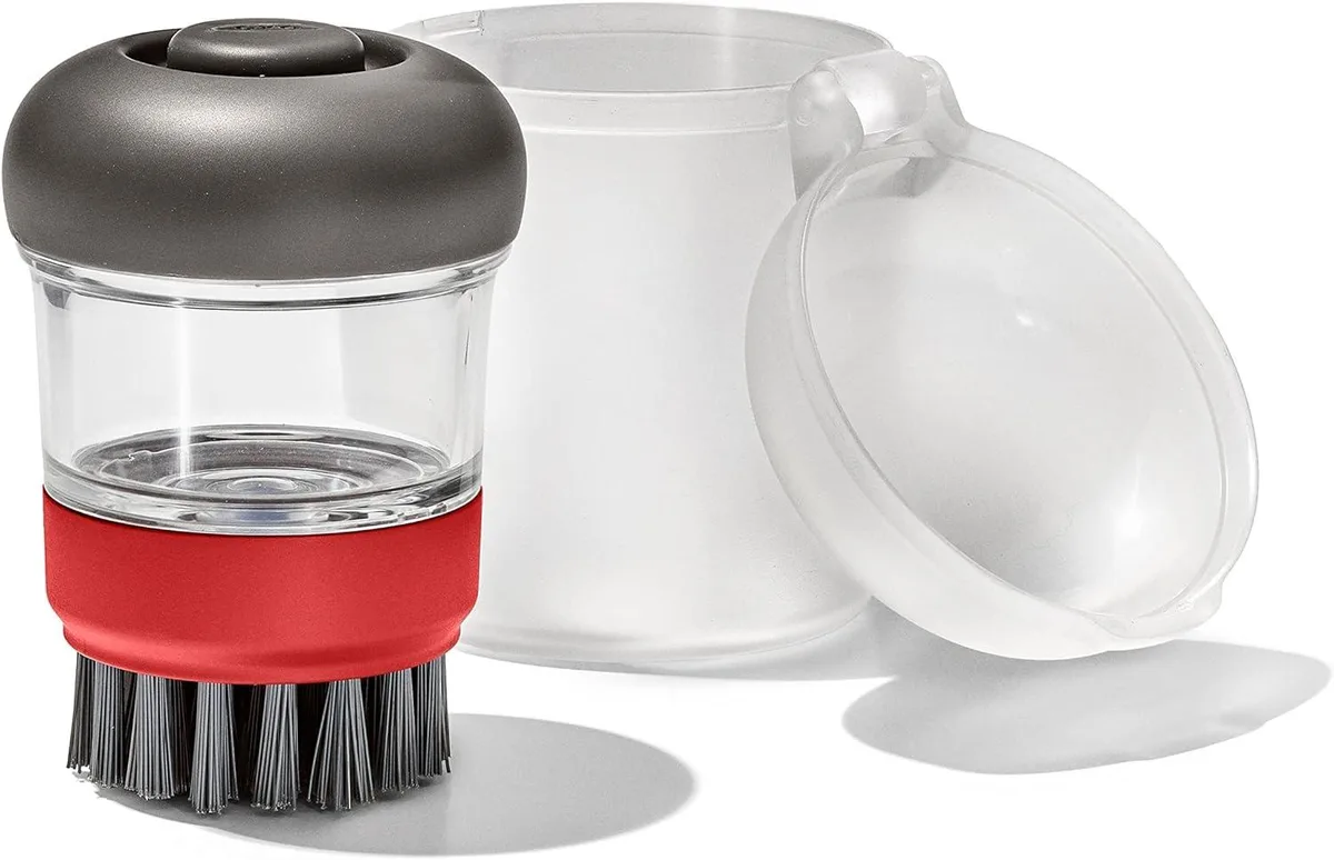 OXO soap dispensing dish brush with storage case, compact square design, light finish