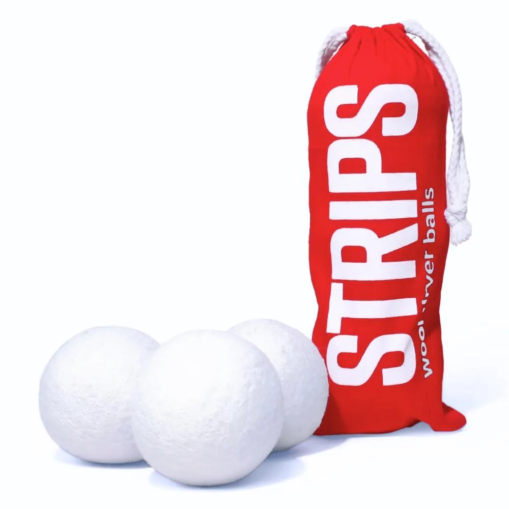 Three natural wool dryer balls in a set of three, cylindrical shape, light neutral colour
