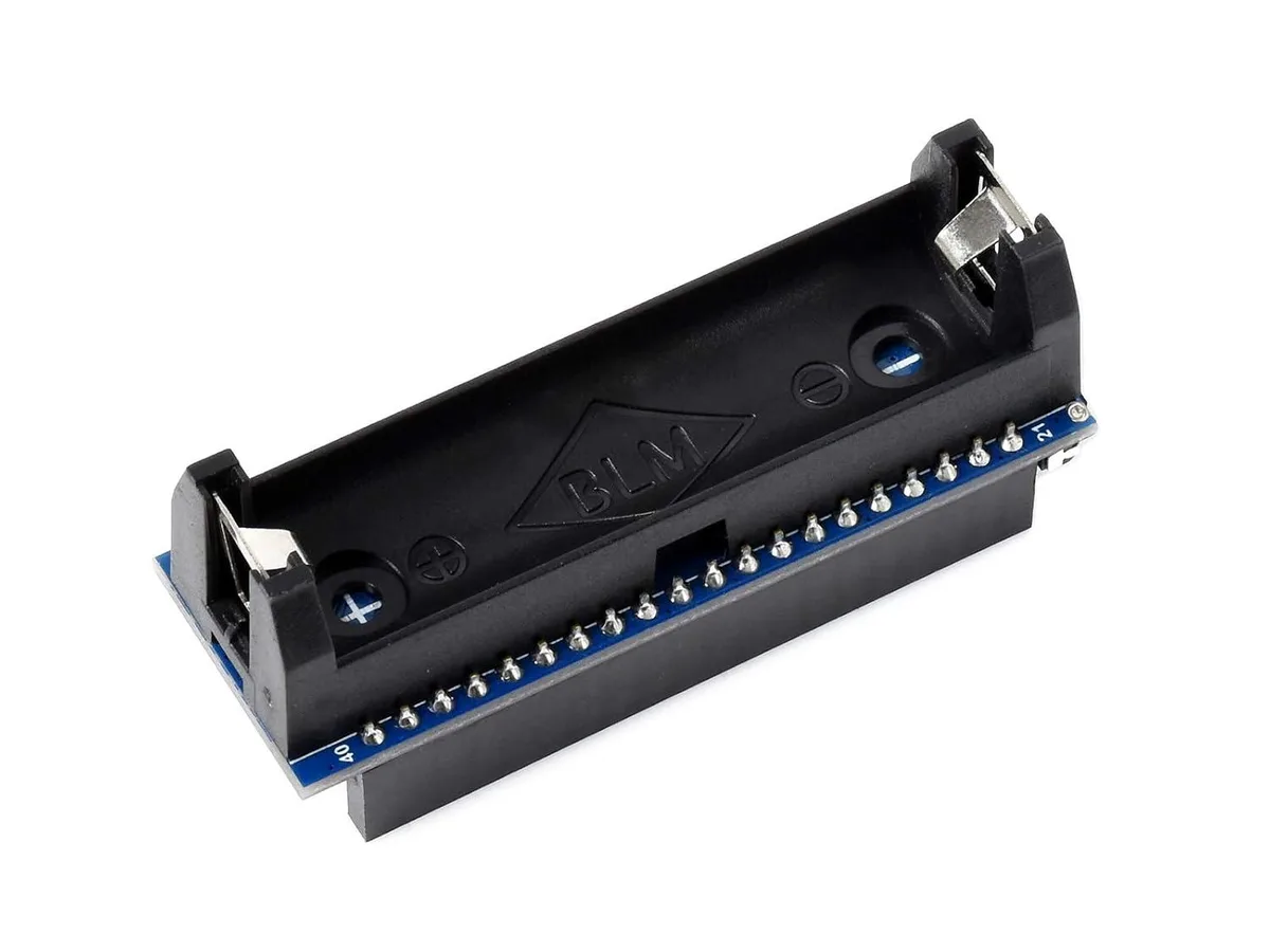 Green rectangular PCB with gold edge connector, surface-mount chips, pin headers, and three small LEDs