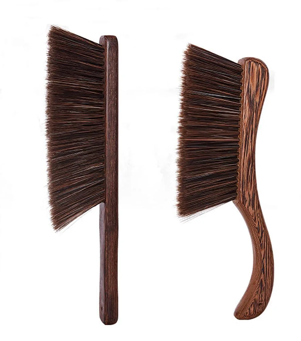 Two brown wooden-handled hand brooms with soft bristles