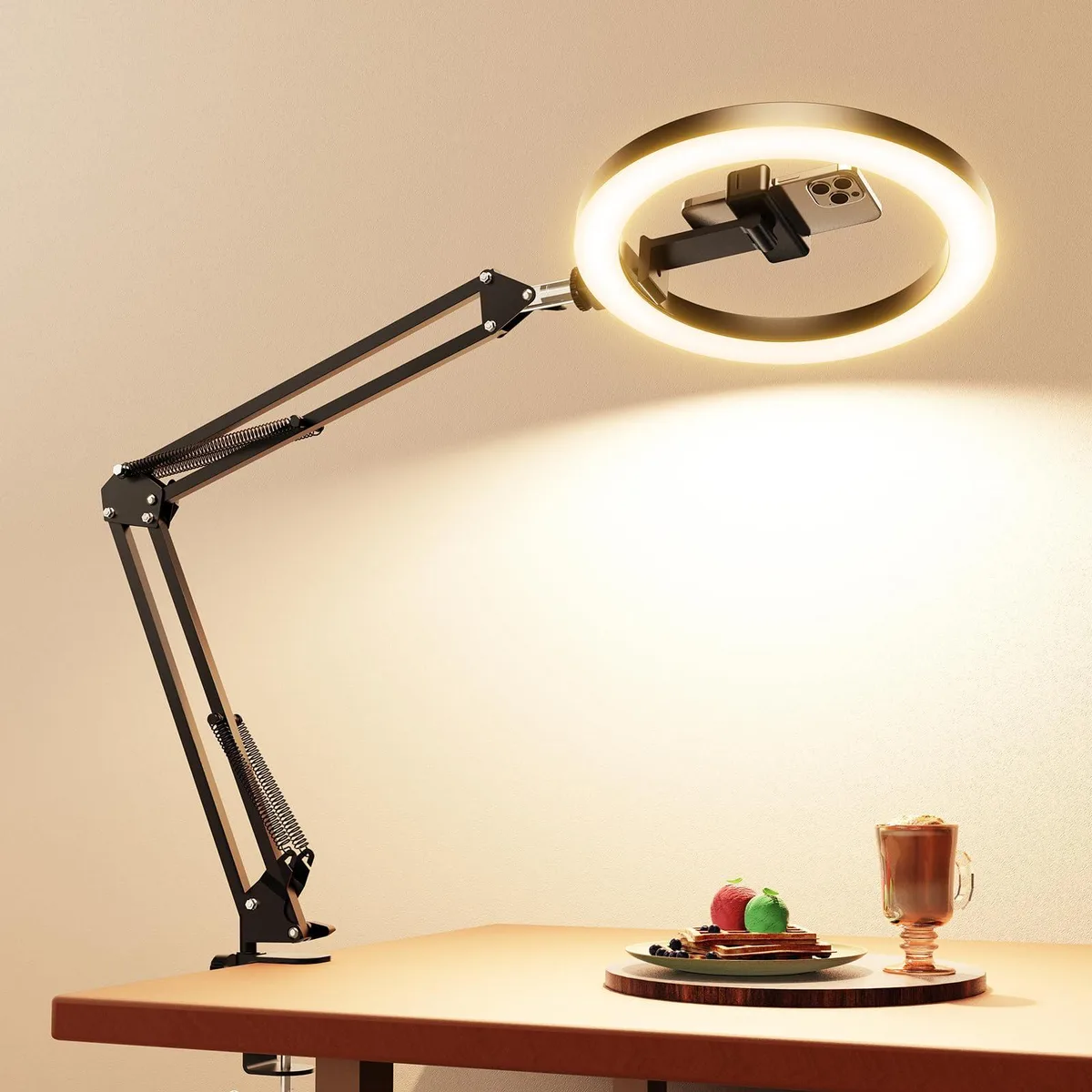 Black 10 inch ring light on flexible overhead arm with desk clamp and phone holder