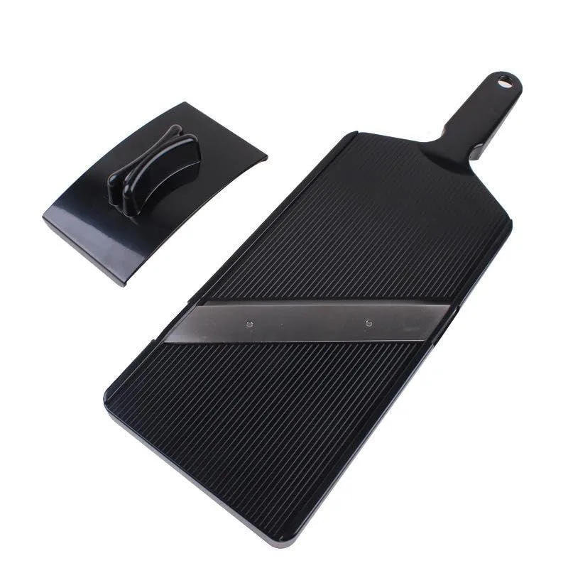 White rectangular manual food slicer with stainless steel blade and black handguard on non-slip base