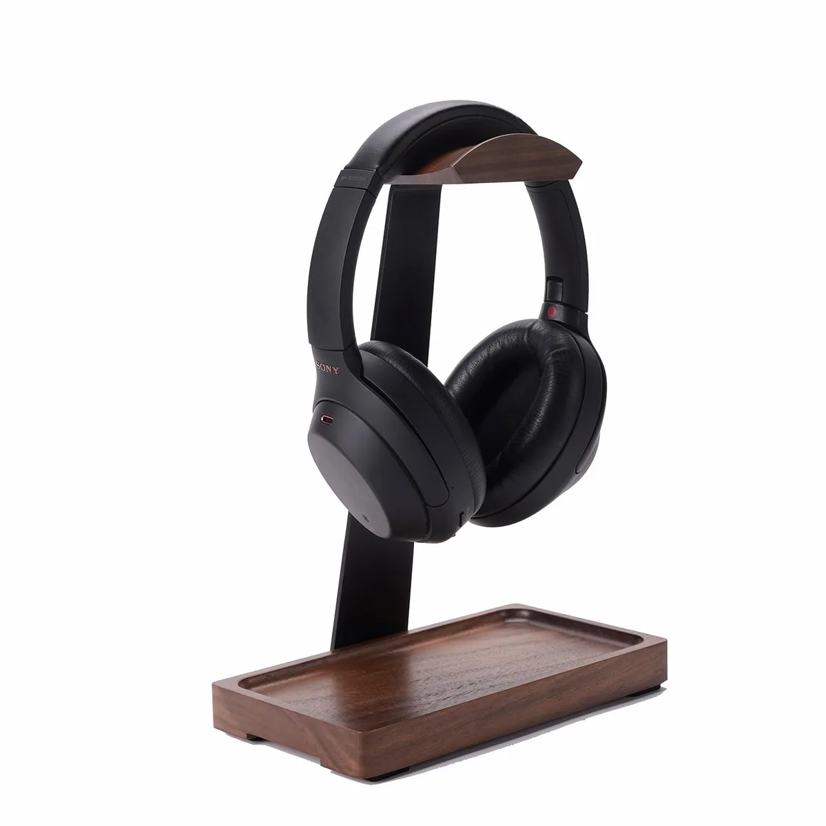 Walnut headphone stand with black aluminium post and storage base