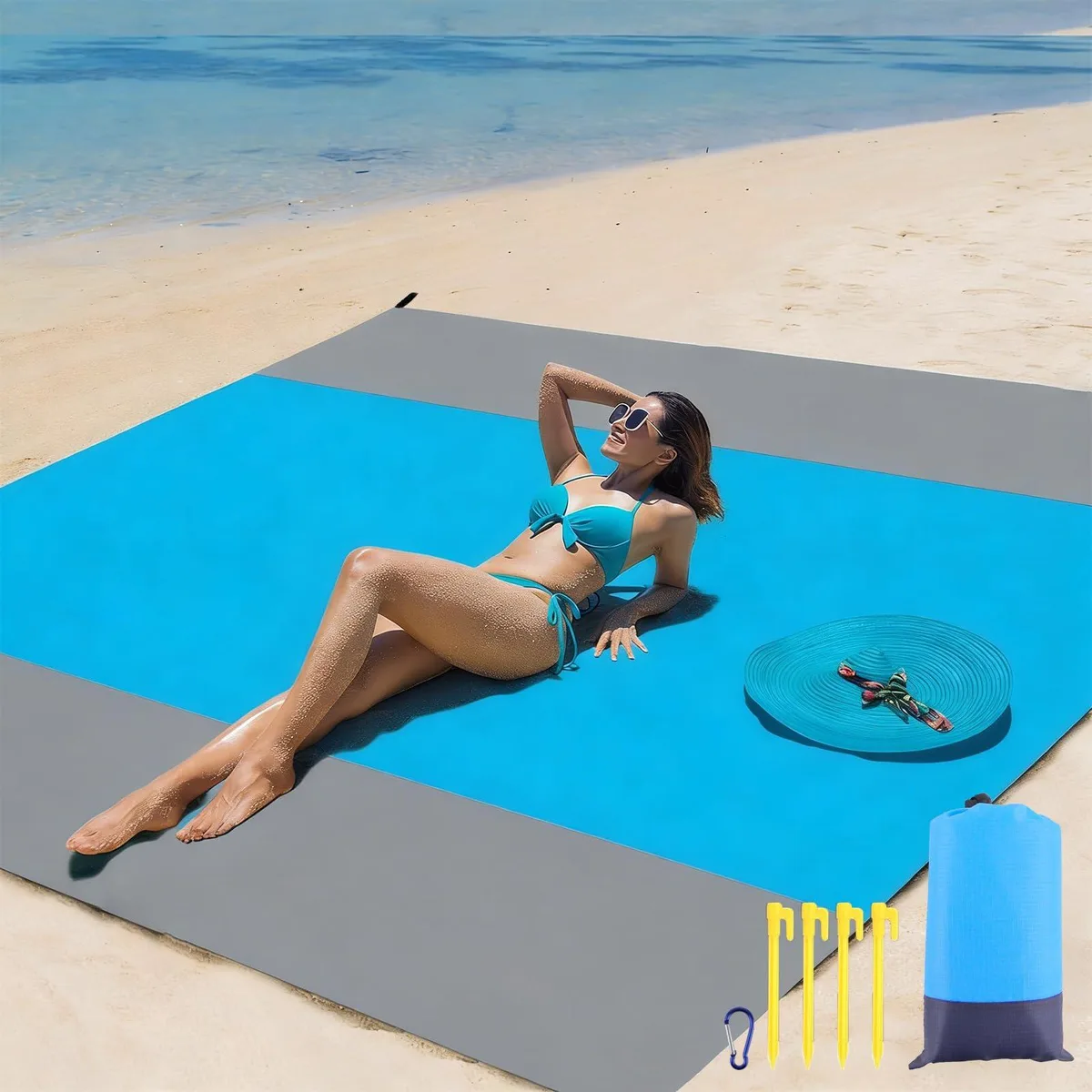 Green square outdoor rug made from recycled plastics, 5 by 8 feet, flat-woven surface with carry bag and stakes