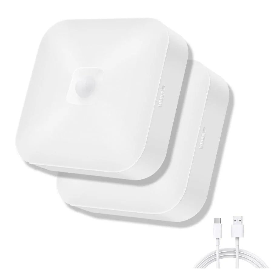 Two white round ceiling lights with frosted covers and motion sensors