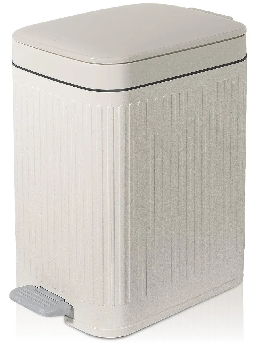 Three slim white step trash cans with foot pedals and soft-close lids
