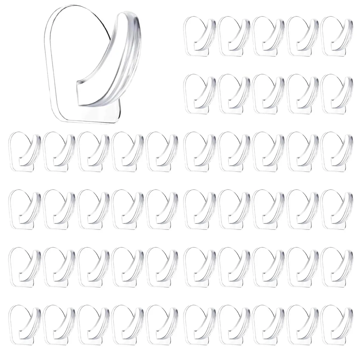 Fifty small transparent plastic adhesive hooks on a backing sheet