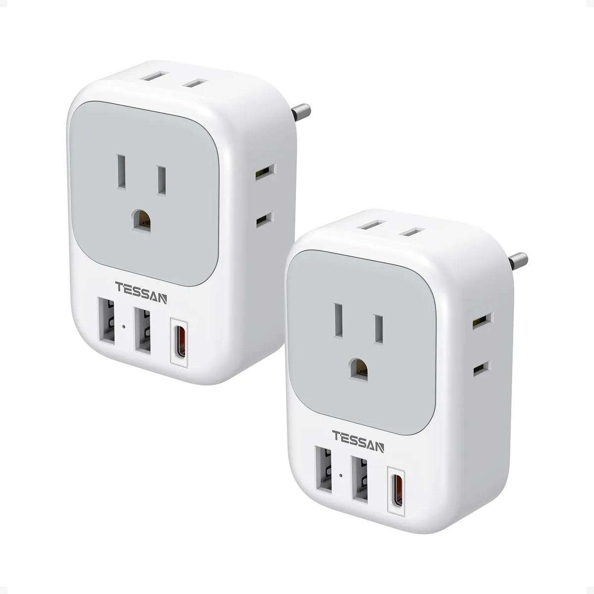 Two white-grey EU travel adapters with four AC outlets and three USB ports each