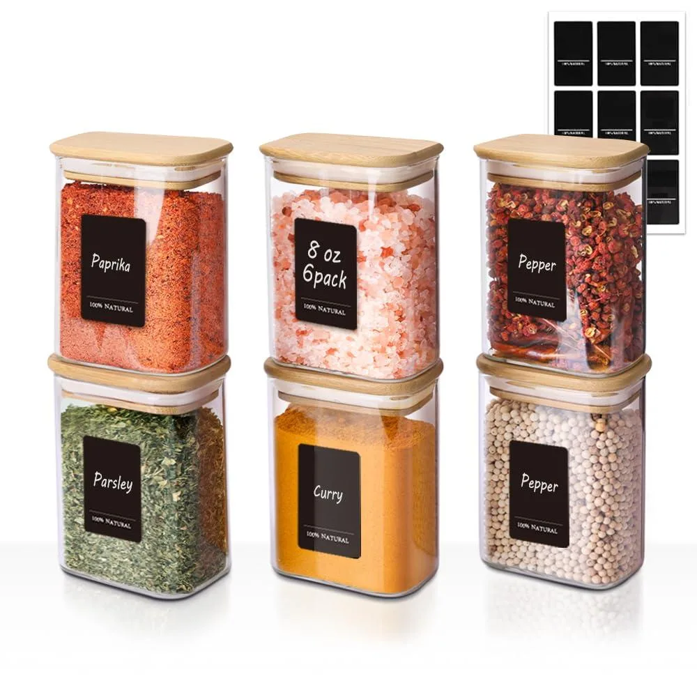 Six rectangular glass jars with red silicone seals and bamboo lids, stacked together