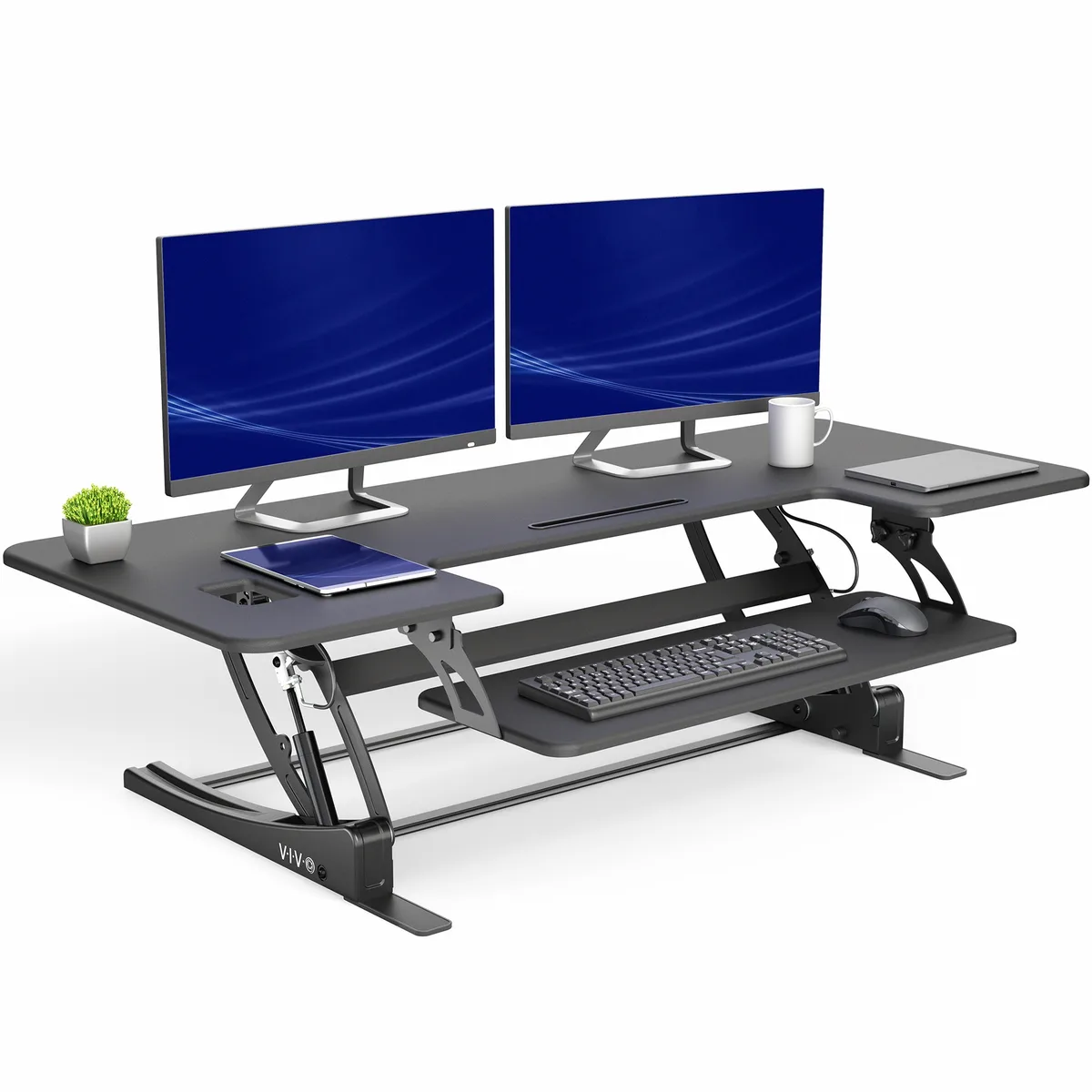 Black dual-tier desk converter on rectangular base, pneumatic lift from 6.5 to 17 inches, 54 by 22 top with removable keyboard tray