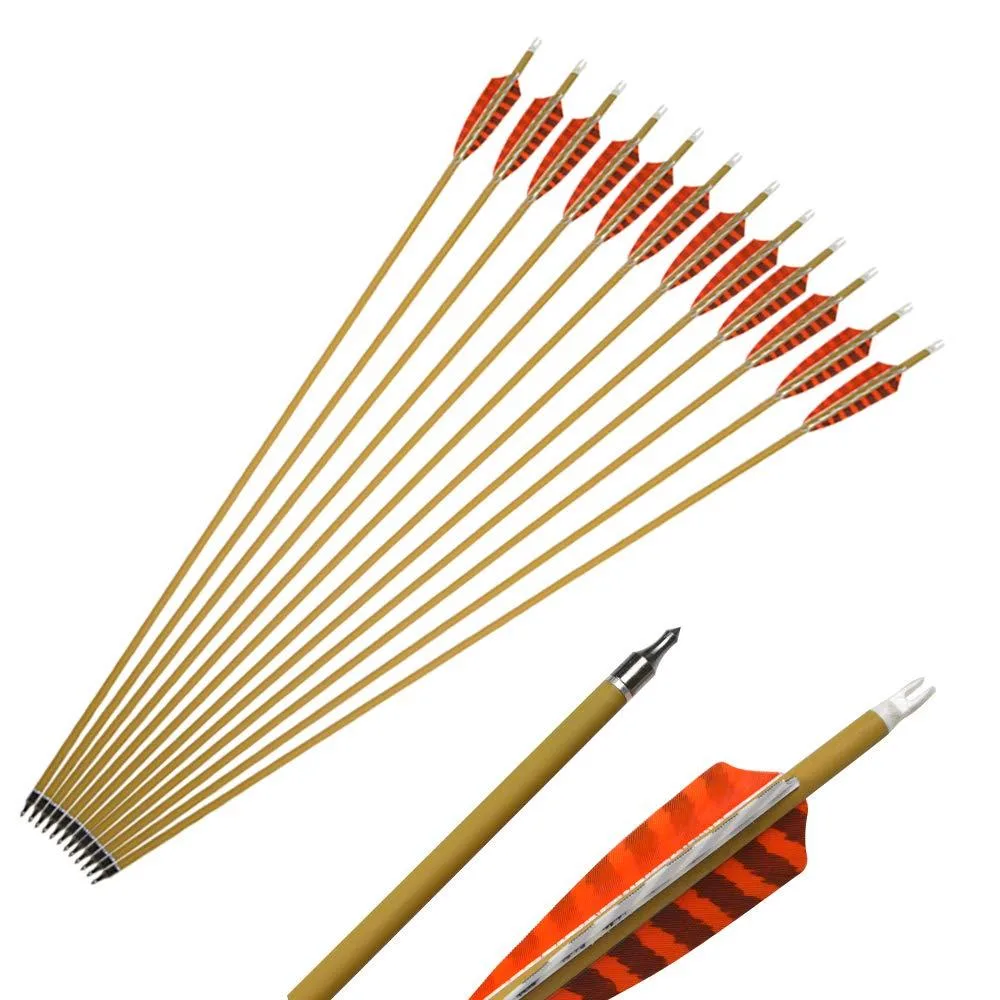 Six orange carbon arrows with white feathers lying together