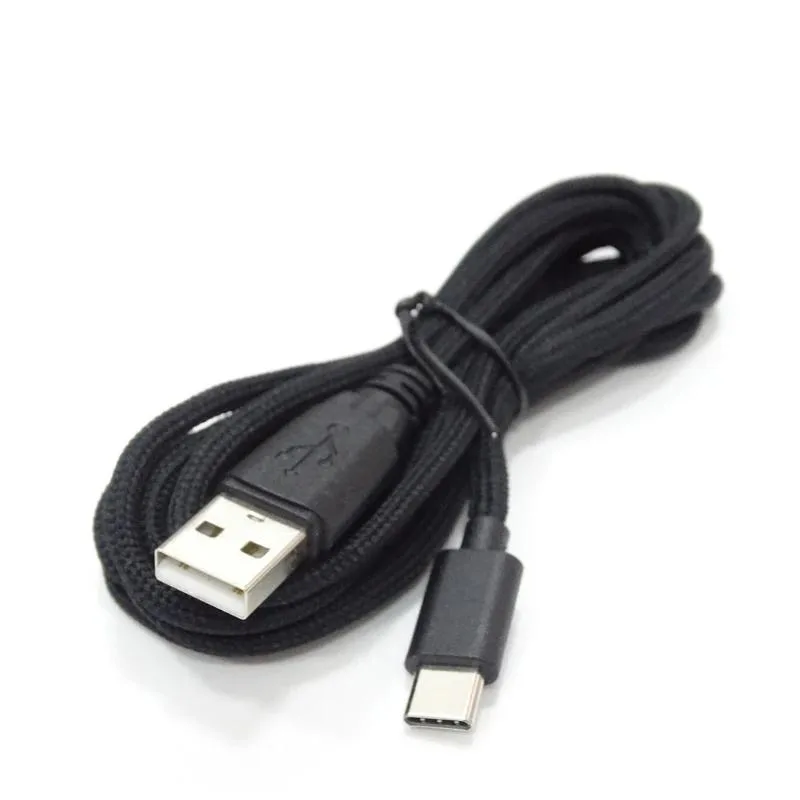 Black USB-C charging cable 1.8 m coiled on white background