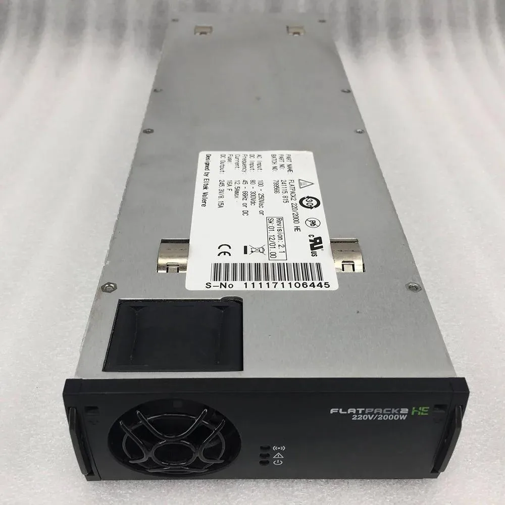 Rectangular ATX power supply unit, matte metal finish, ventilation grilles, label showing 220 2000 HE 245.3V 8.1