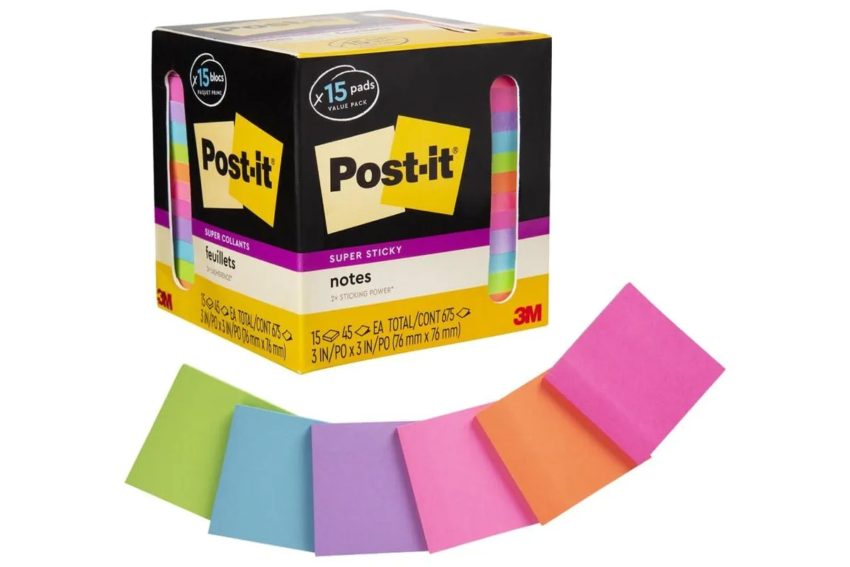 Fifteen square pads of bright neon sticky notes in a paperboard carton