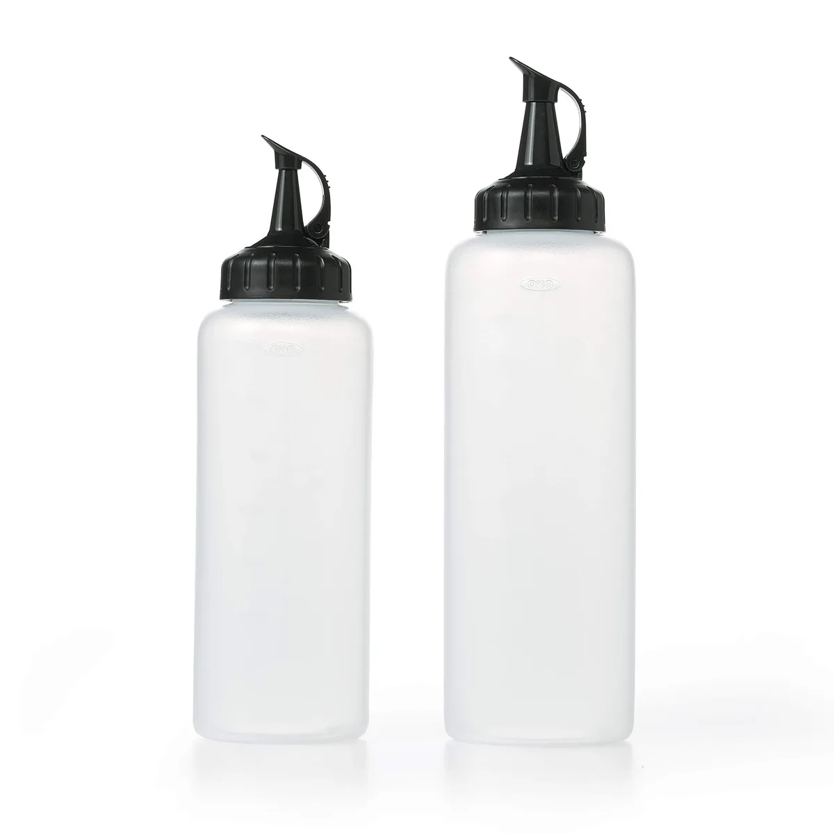 Two clear plastic squeeze bottles with caps, 12 oz and 16 oz, measurement markings visible