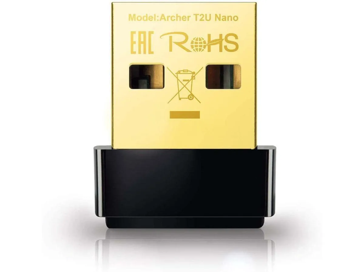 Tiny black USB Wi-Fi adapter protruding slightly from port