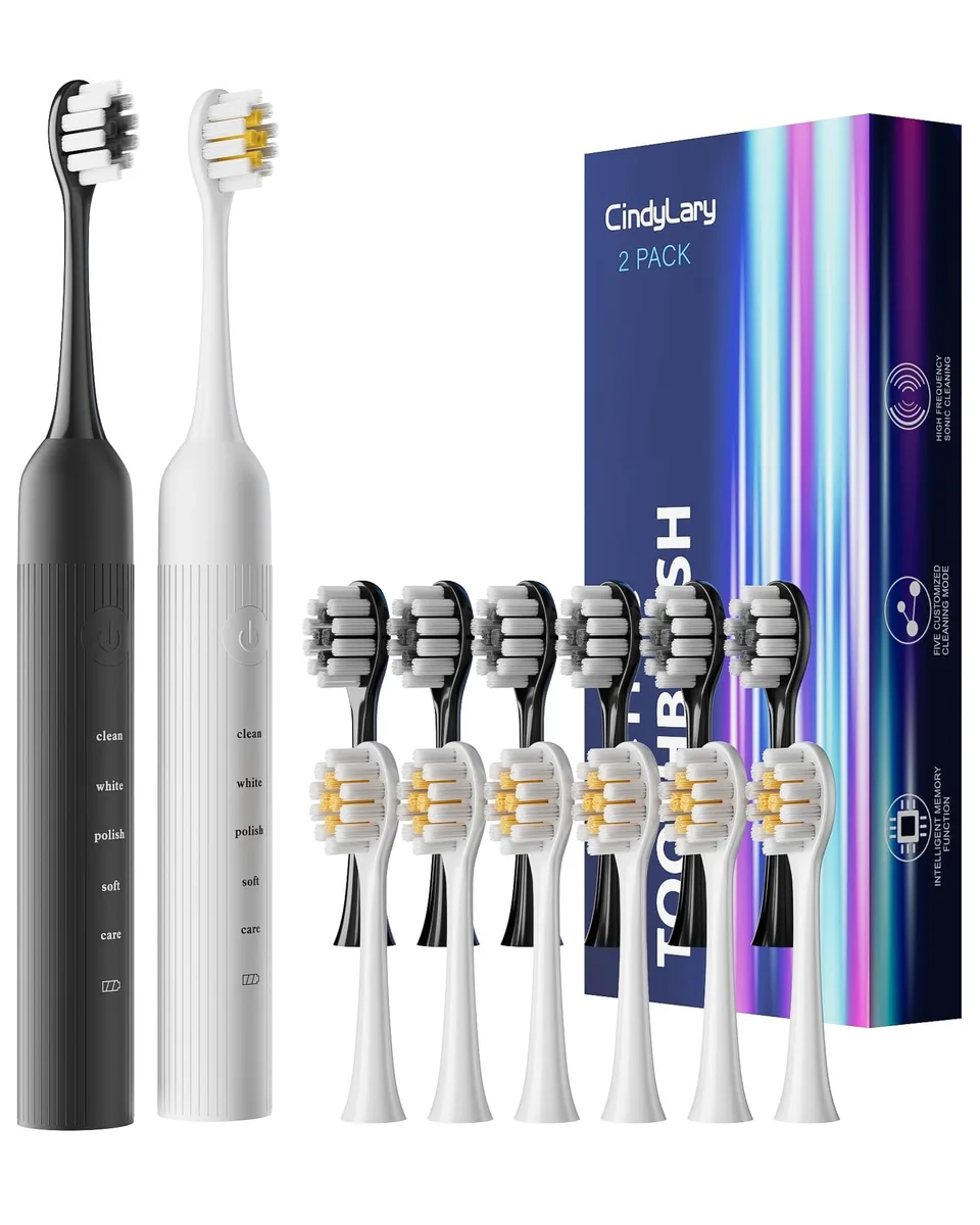 Two electric toothbrushes in black and white with multiple brush heads