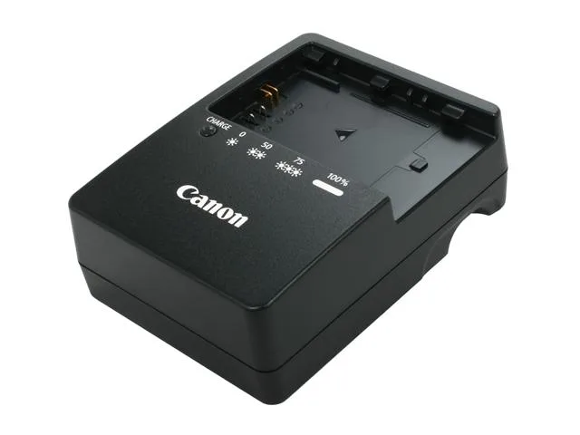 Compact black rectangular charger with fold-out mains prongs, status LED, and slot for LP-E6 battery