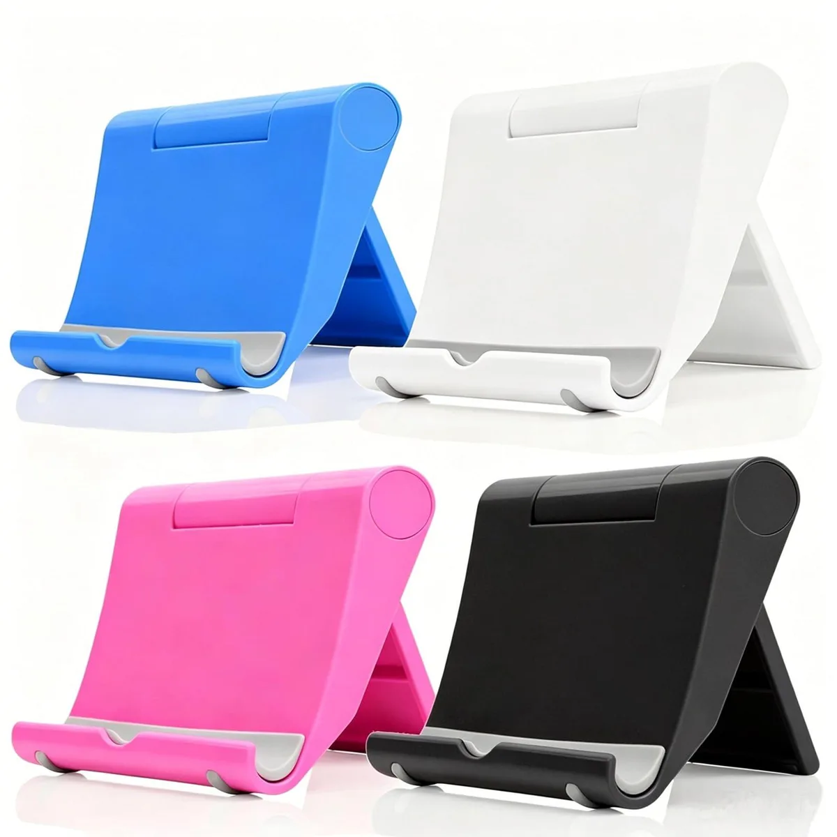 Four foldable phone stands in black pink blue white, flat on desk