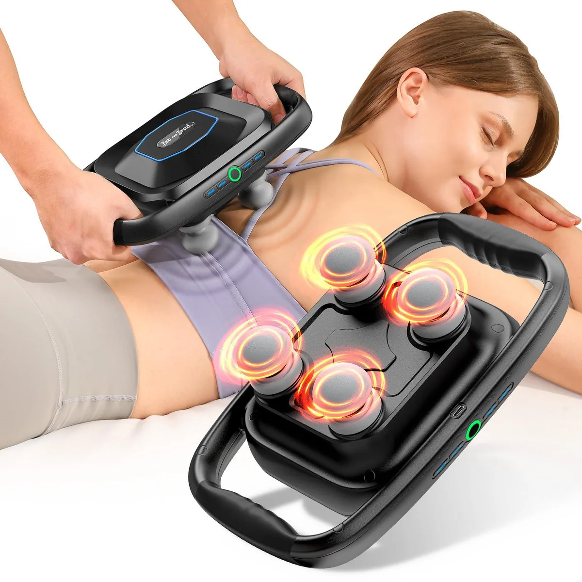 Black rectangular massage device with four round heads on a flat panel, handheld grip, matte finish