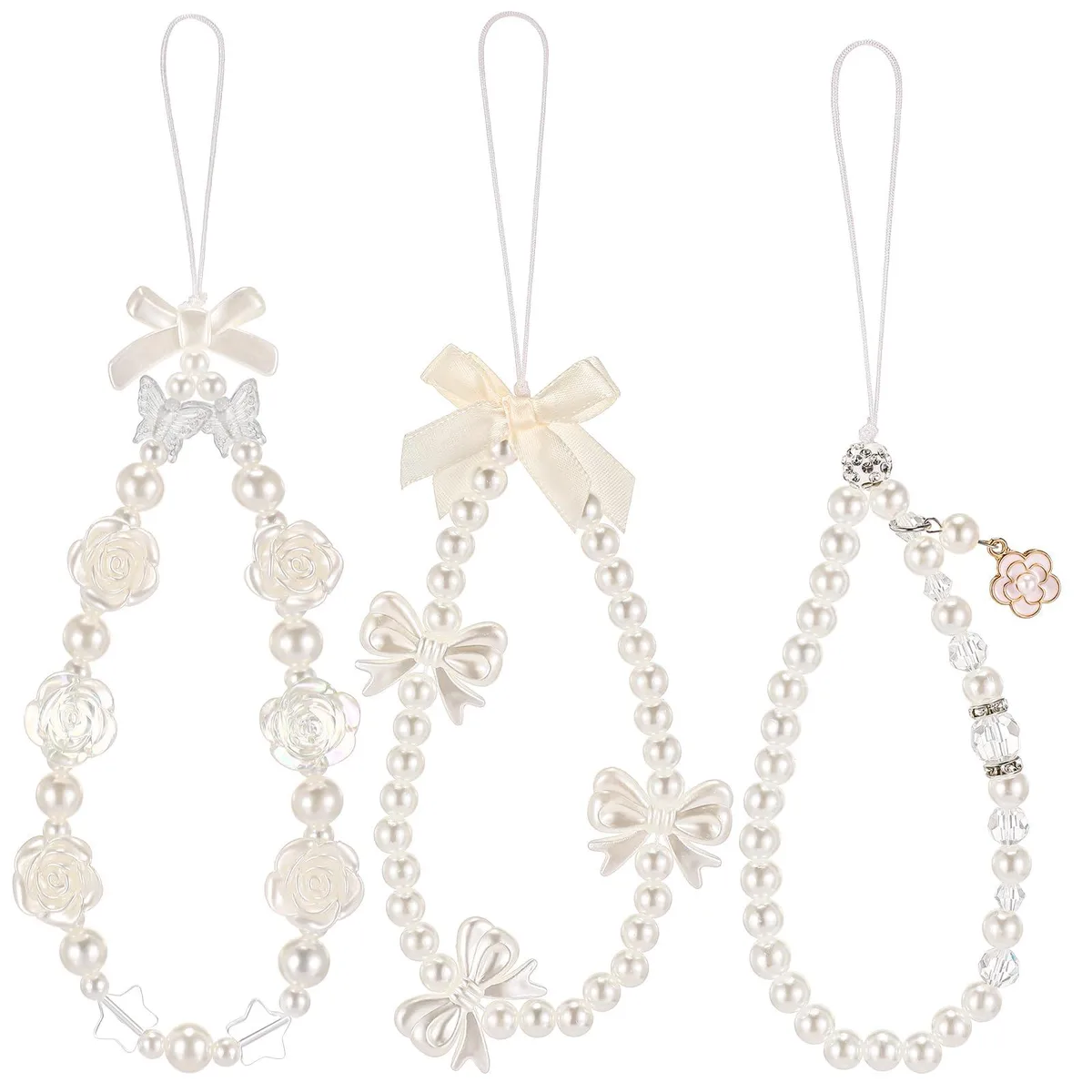 Three white pearl beaded wrist lanyards with butterfly and flower charms