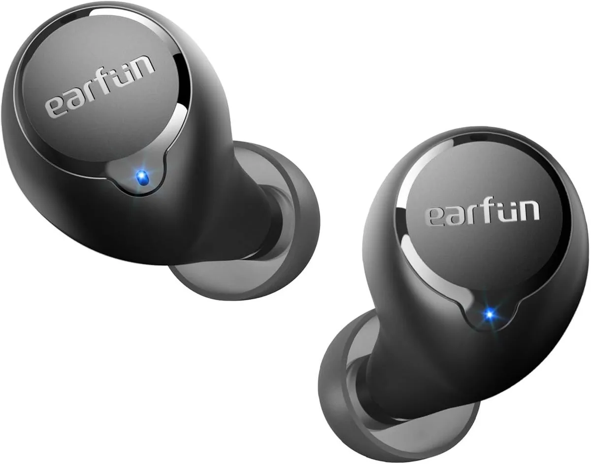 Pair of in-ear wireless earbuds in charging case