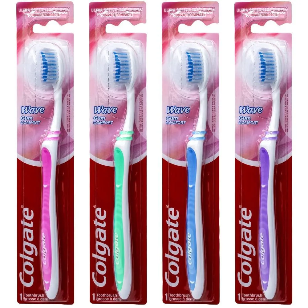 Four white manual toothbrushes with compact heads and curved ergonomic handles