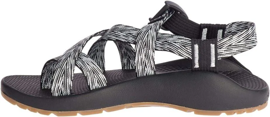 Black synthetic women's sandal with adjustable polyester webbing straps, toe loop and moulded ladder-lock buckle on contoured footbed