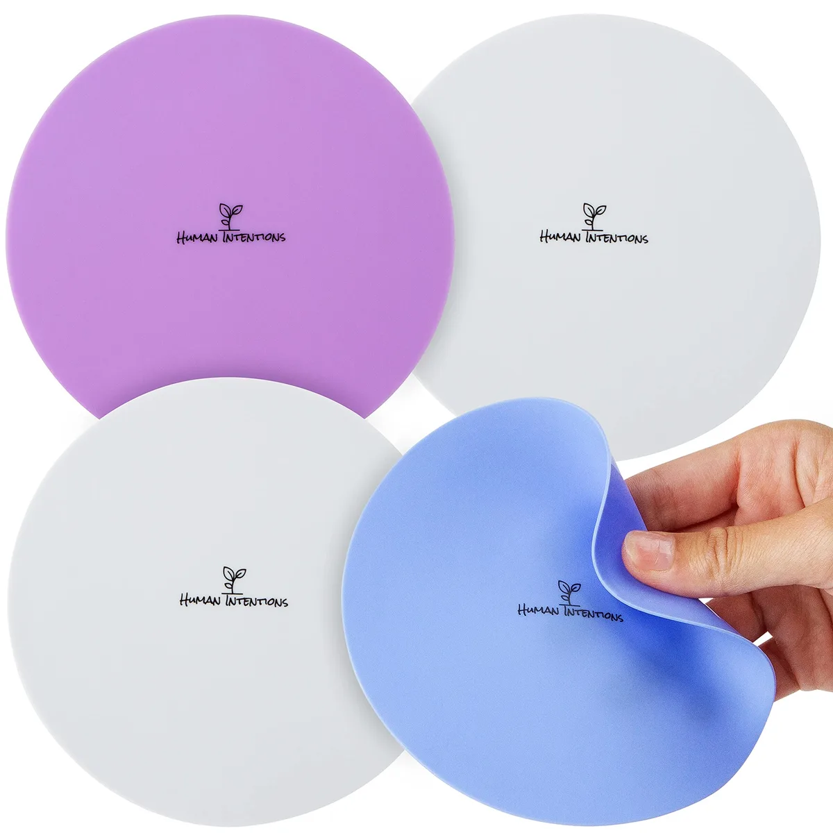 Four round silicone grip pads in violet, light blue, grey and white, each five inches wide