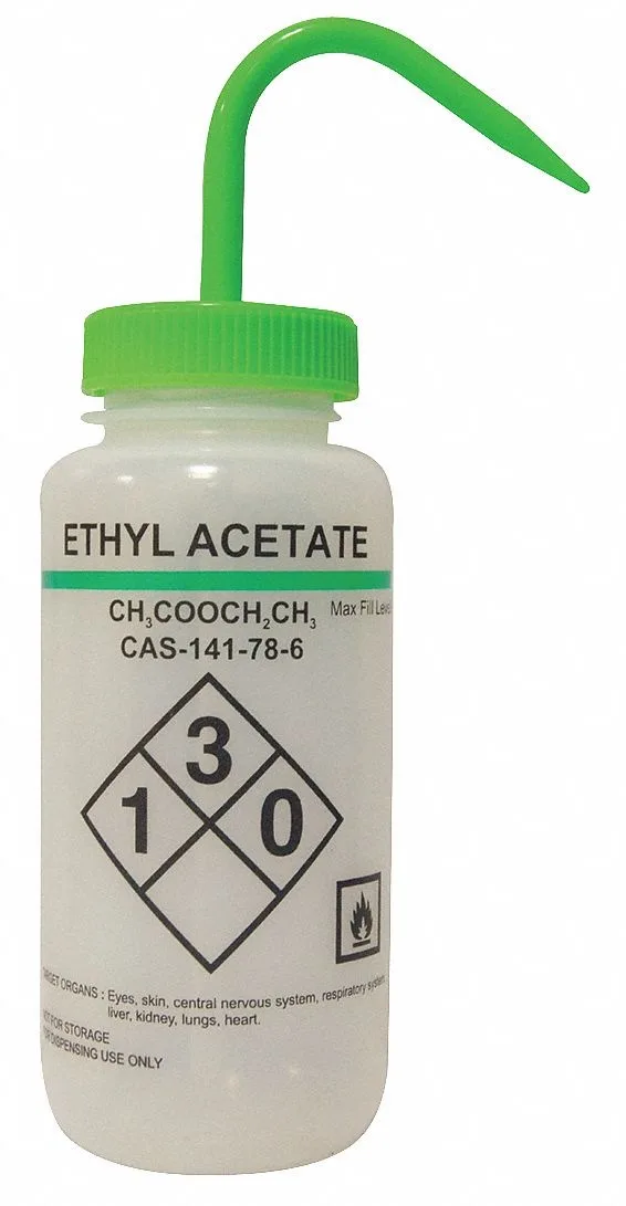 Six translucent plastic wash bottles with green caps arranged together