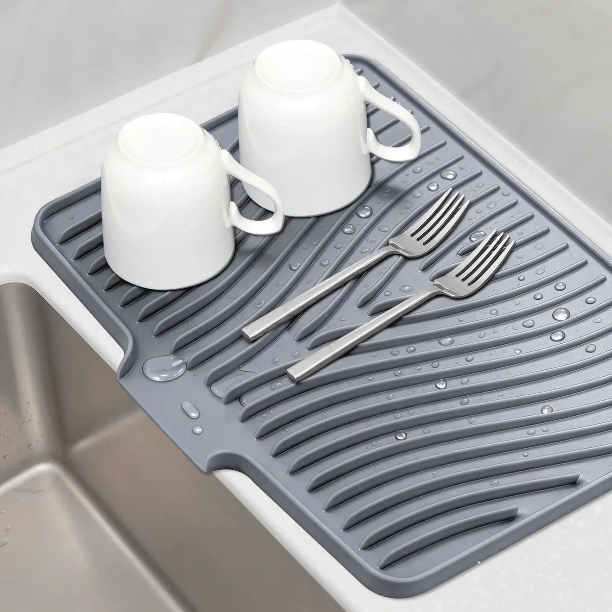 Grey silicone drying mat 16 by 12 inches with raised textured bumps and open edge