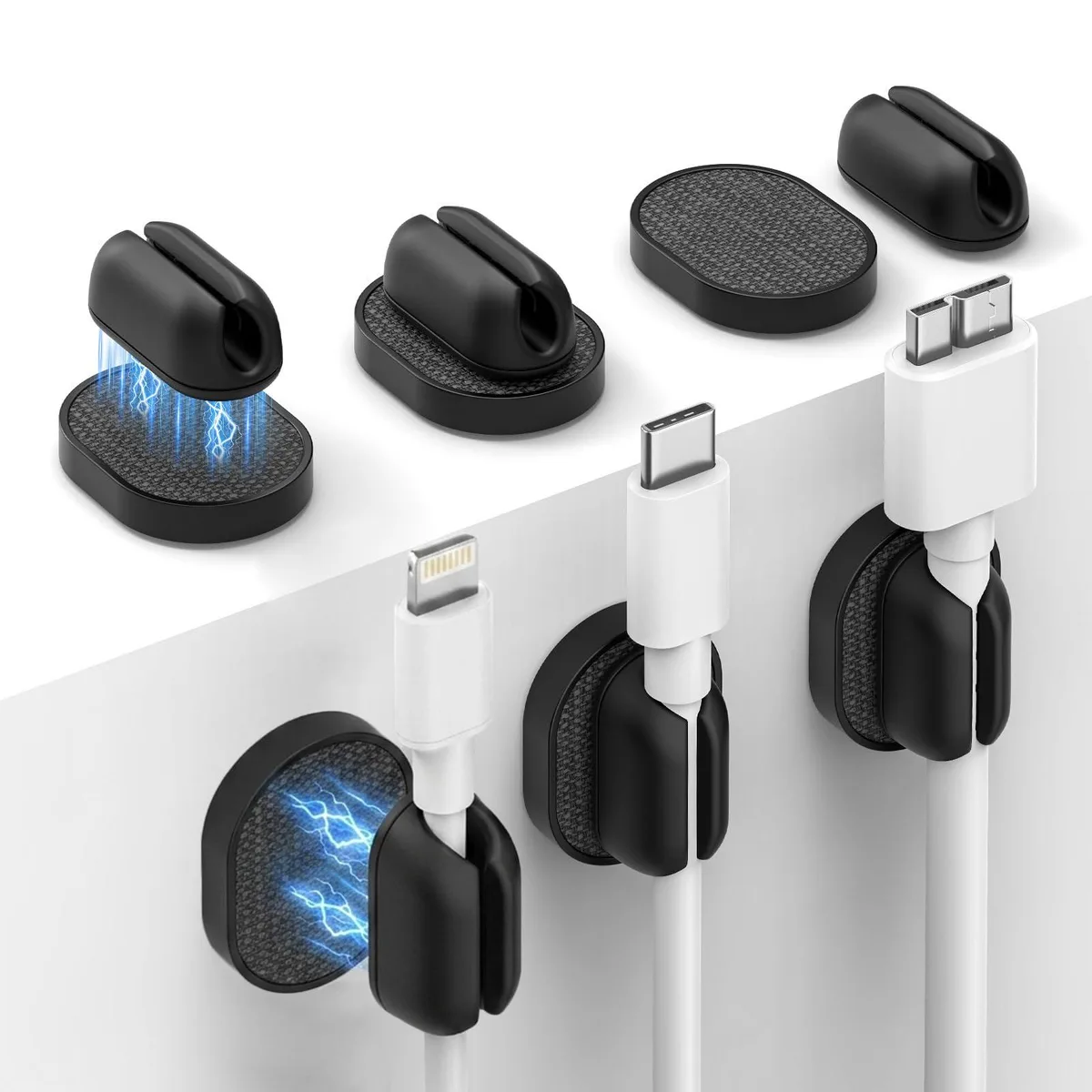 Six small black silicone magnetic cable clips with adhesive backs