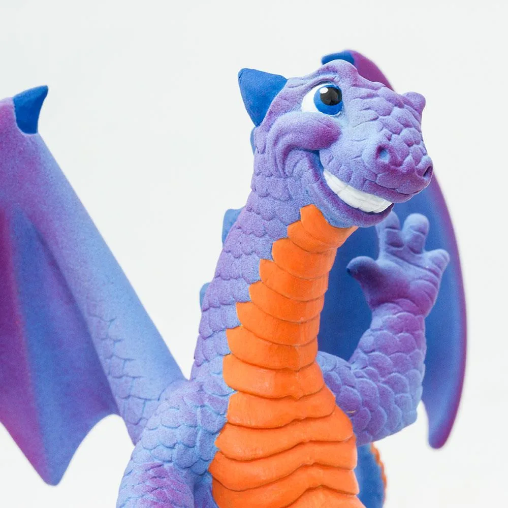 Bluish-purple dragon figure with orange underbelly, blue horns and claws, smiling face