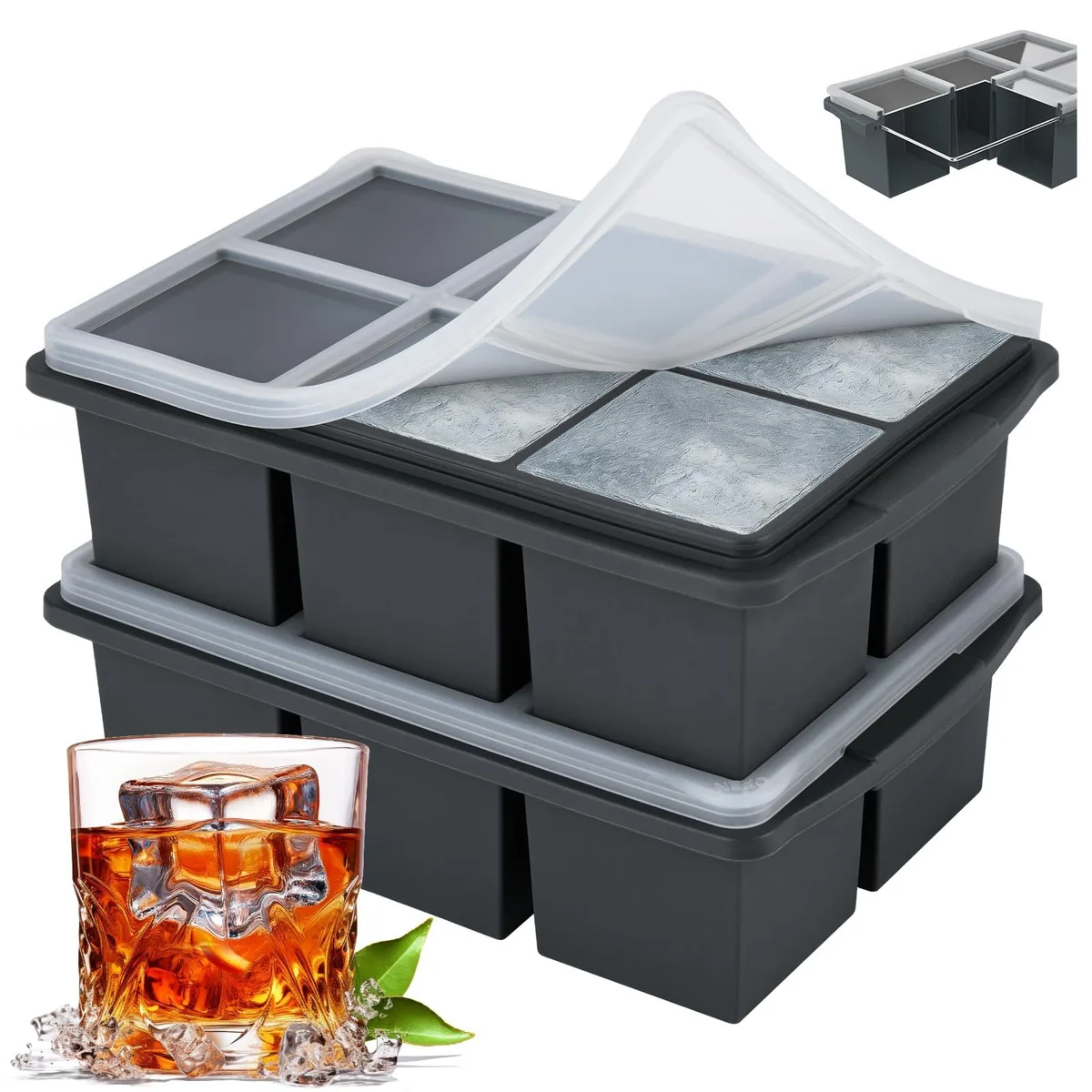 Two black silicone ice cube trays with clear lids and steel-rimmed tops, each holding six large square cubes