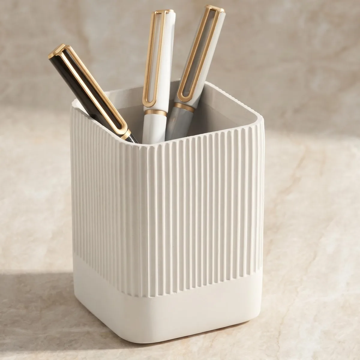 Blue concrete pen holder, square base 2.75 by 2.75 inches, height 3.75 inches