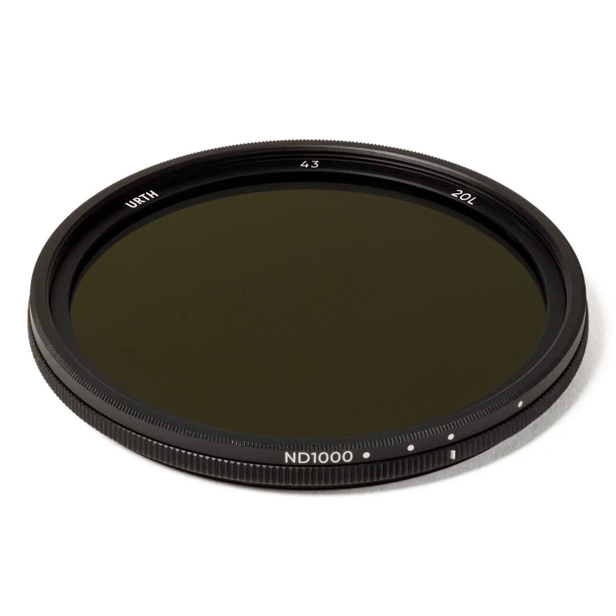 A thin circular glass filter with a slim black metal ring, double-threaded edges and clear optical surface