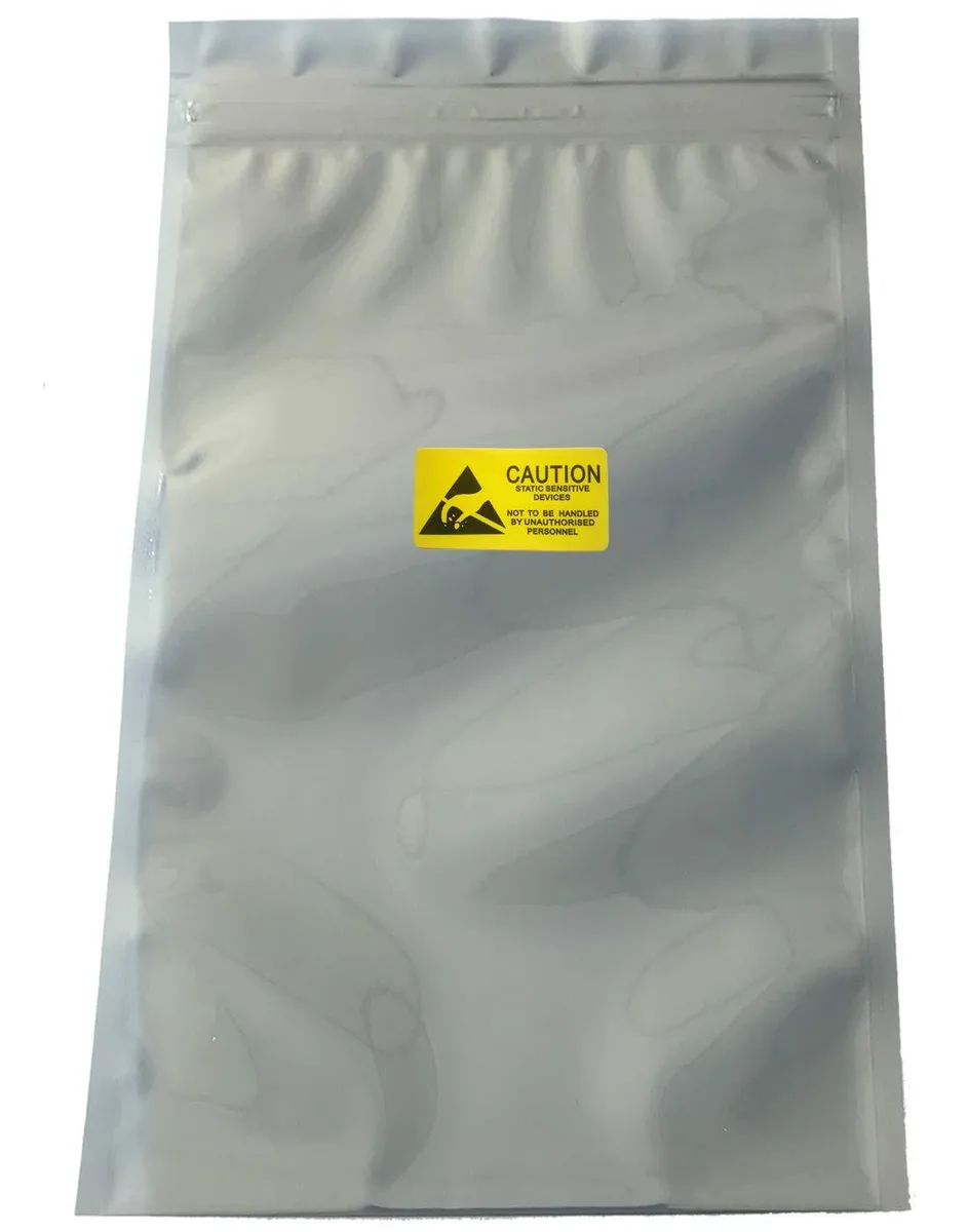 Ten silver-metallic resealable bags with labels on a flat surface