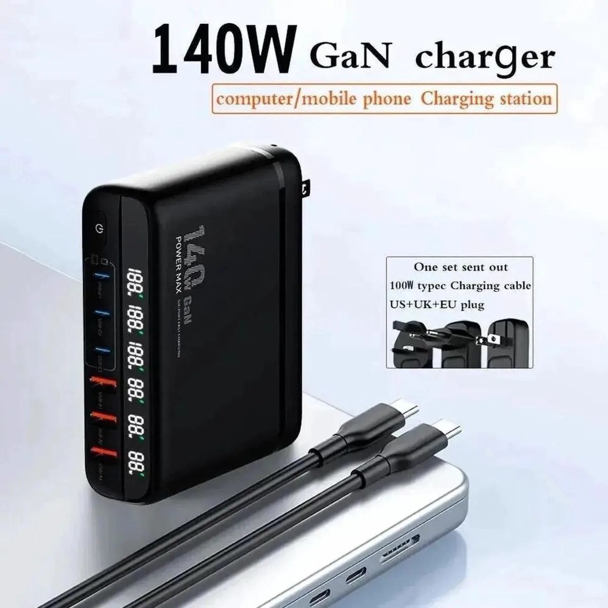 Black rectangular GaN charger block with three USB-C and three USB-A ports, detachable AC cable and interchangeable plug heads