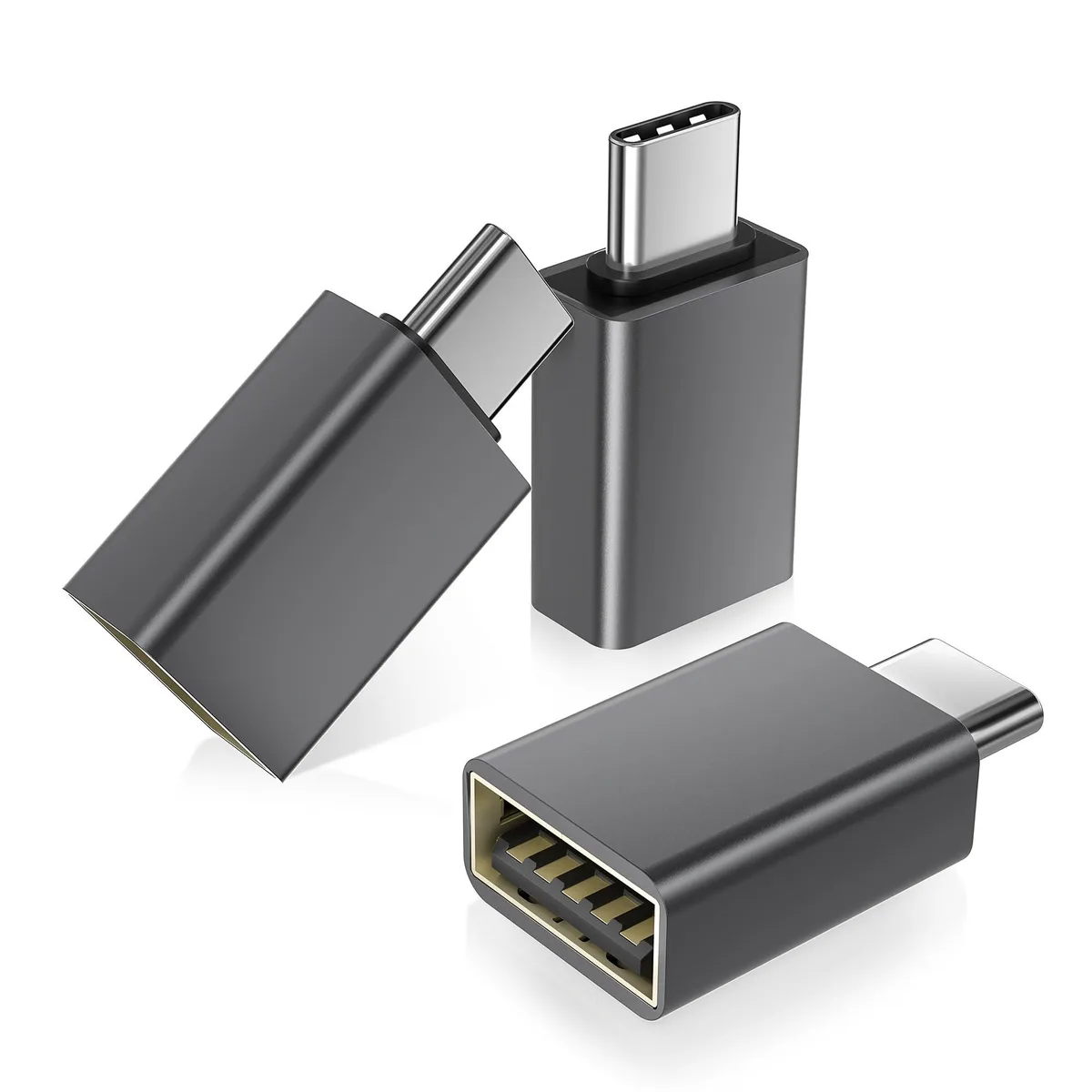 Three small gray USB-C male to USB-A female adapters side by side
