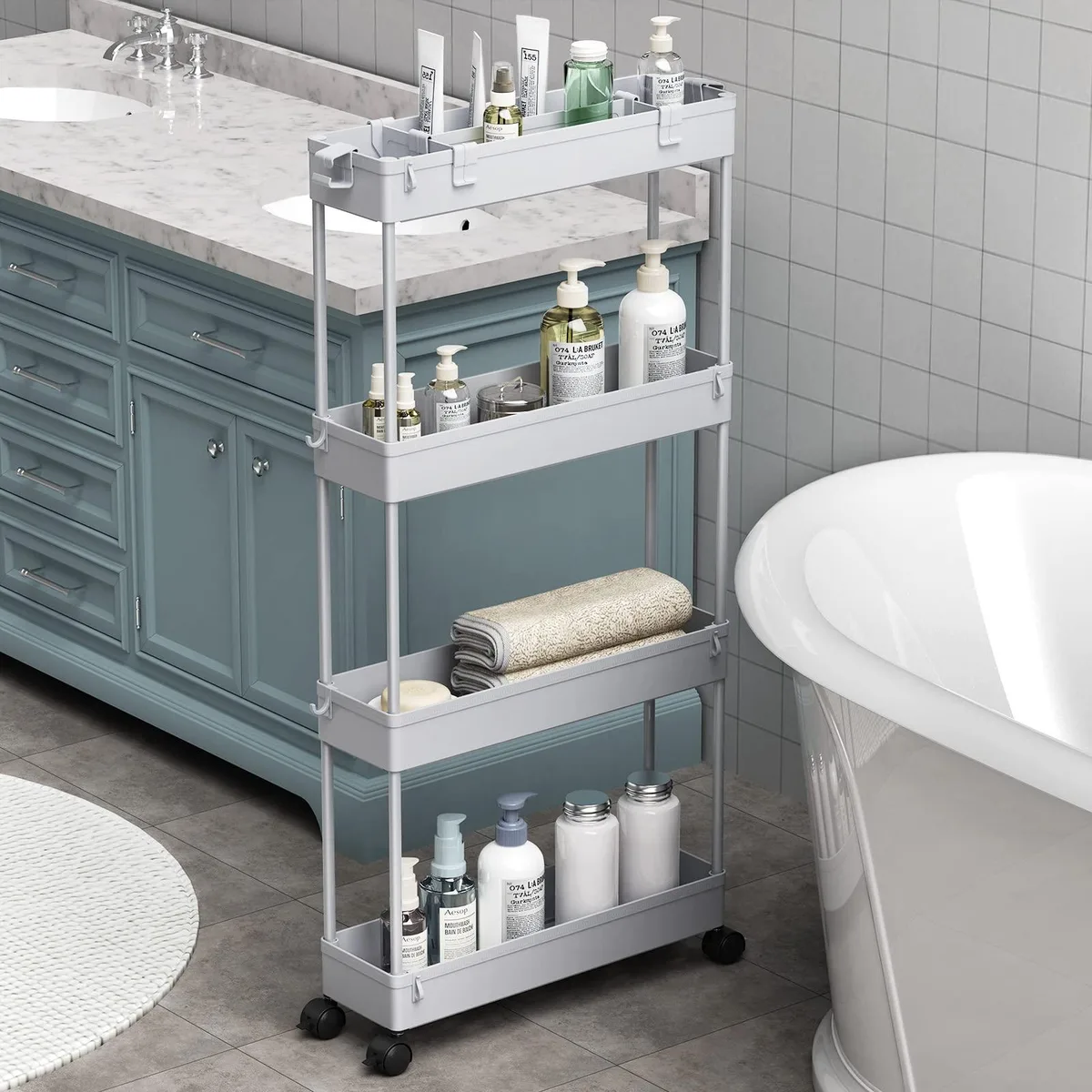 Grey four-tier plastic cart on 360° wheels, 4.9in wide by 38.7in high with mesh-bottom shelves