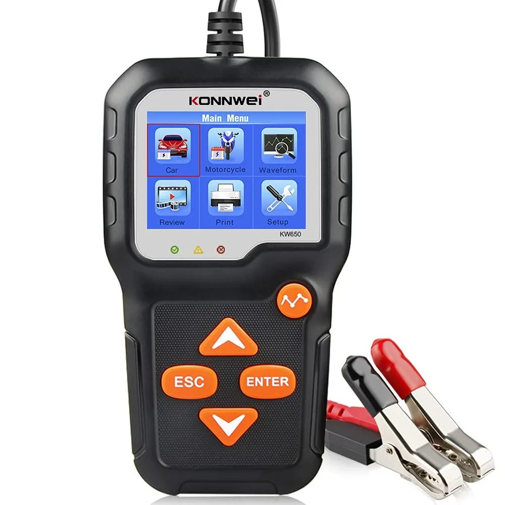 Handheld battery tester with colour screen and clamp leads, compact dark casing