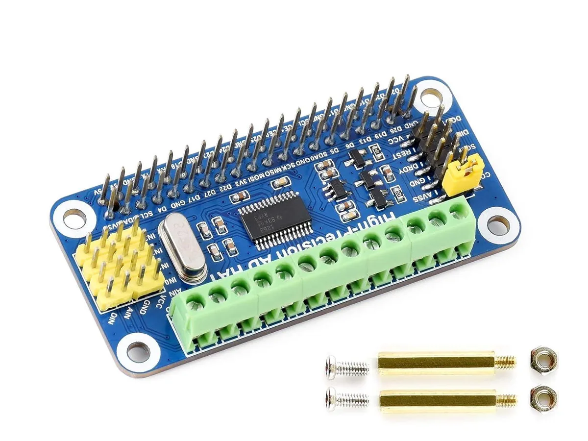 Green circuit board with 40-pin GPIO header, screw terminals, and pin headers