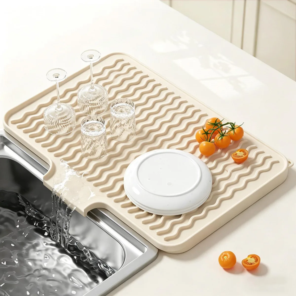 Beige silicone drying mat 16 by 12 inches with wavy ridges and side spout