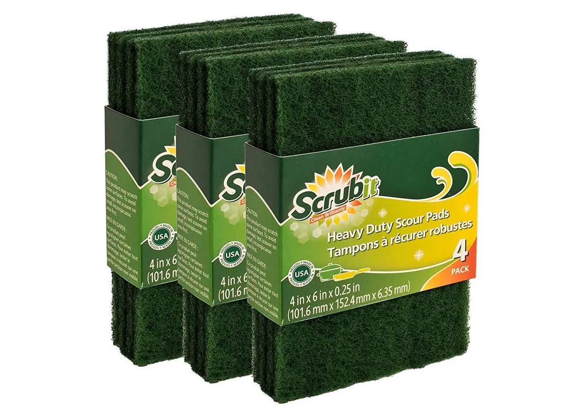 Pack of twelve green rectangular scouring pads in cardboard sleeve