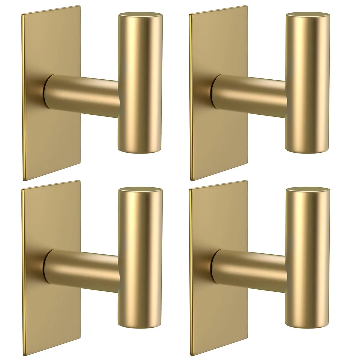 Four gold stainless steel adhesive hooks on a smooth surface