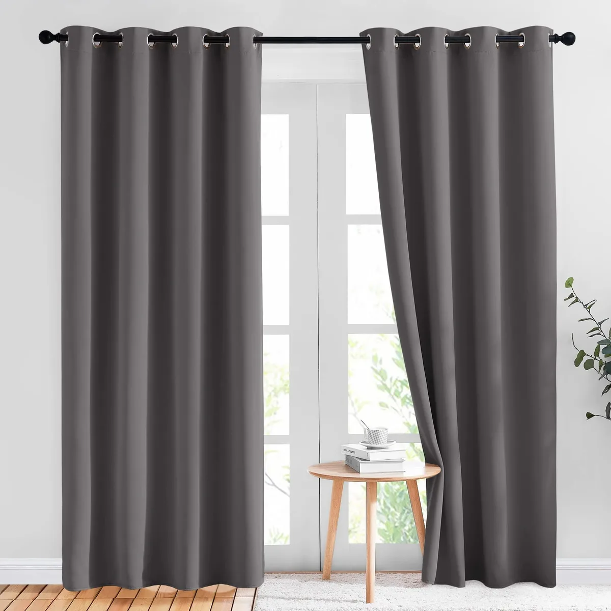 Two grey blackout curtain panels with silver grommets, 52 by 84 inches, polyester fabric