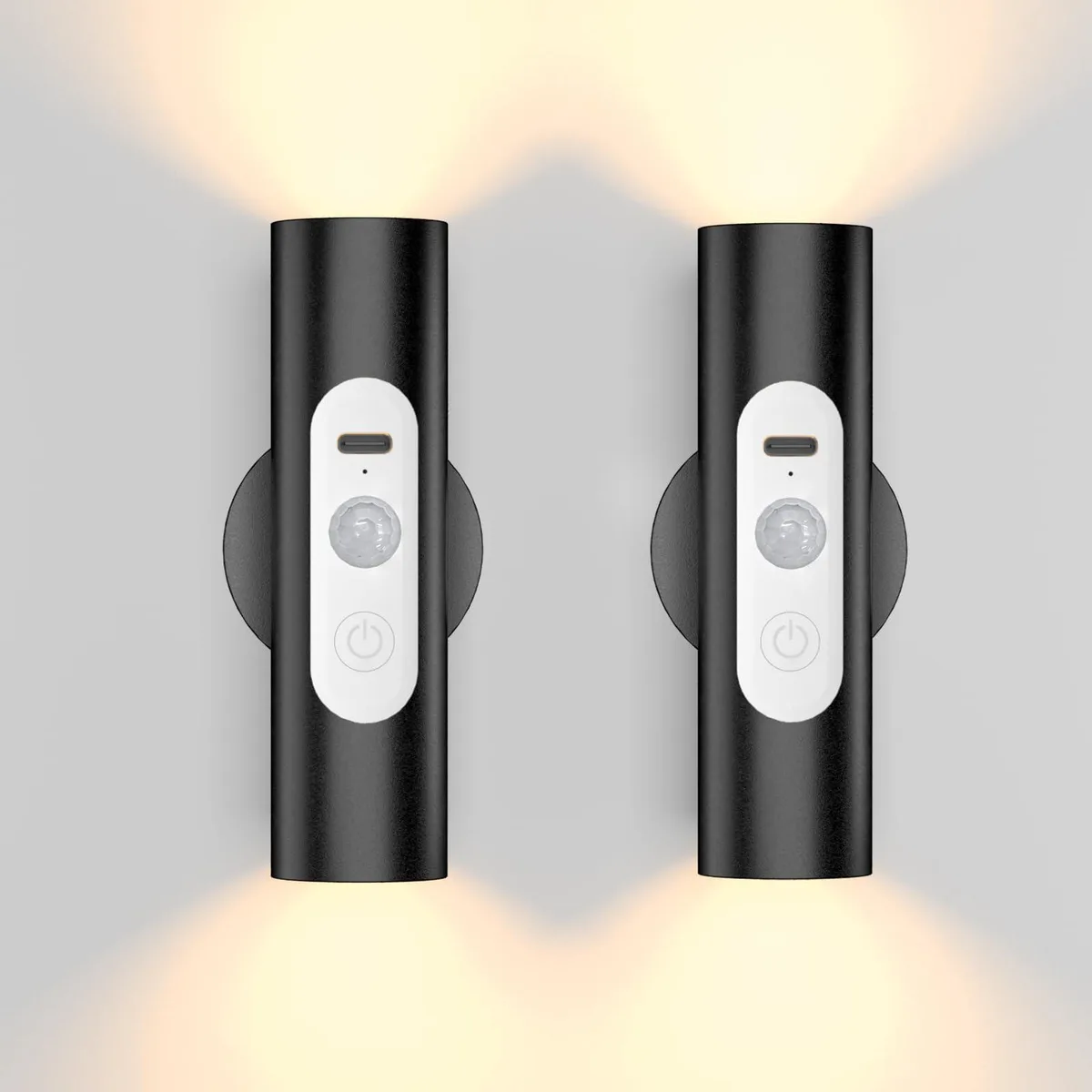 Two black cylindrical LED wall lights with magnetic plates and a remote control