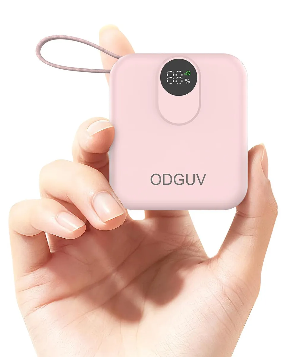 Small pink rectangular power bank with built-in cables visible