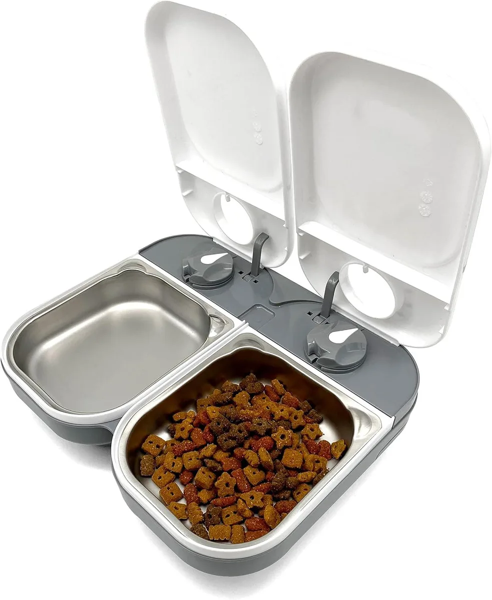 White automatic pet feeder with two stainless steel bowls and removable lids
